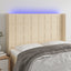 sengegavl med LED-lys 147x16x118/128 cm stof cremefarvet