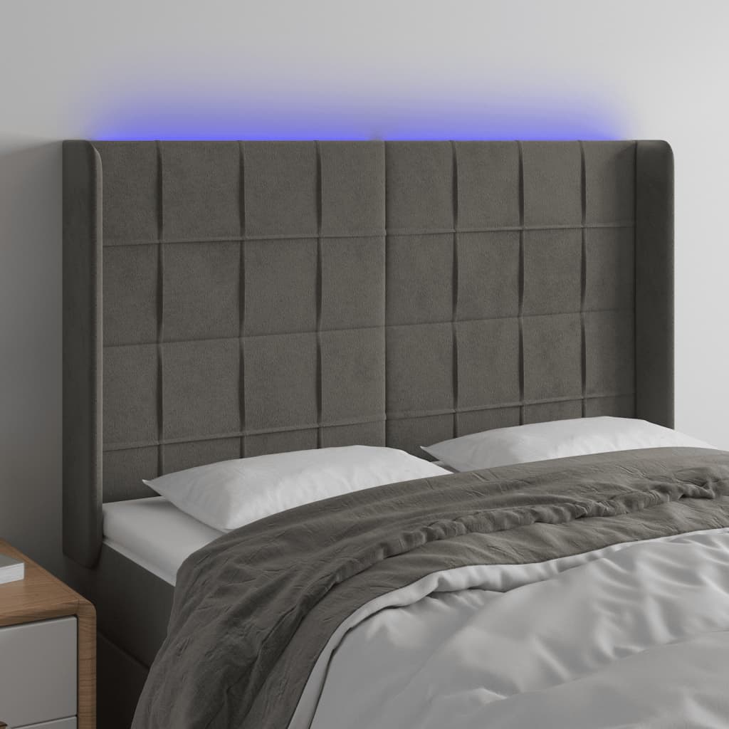 sengegavl med LED-lys 147x16x118/128 cm fløjl mørkegrå