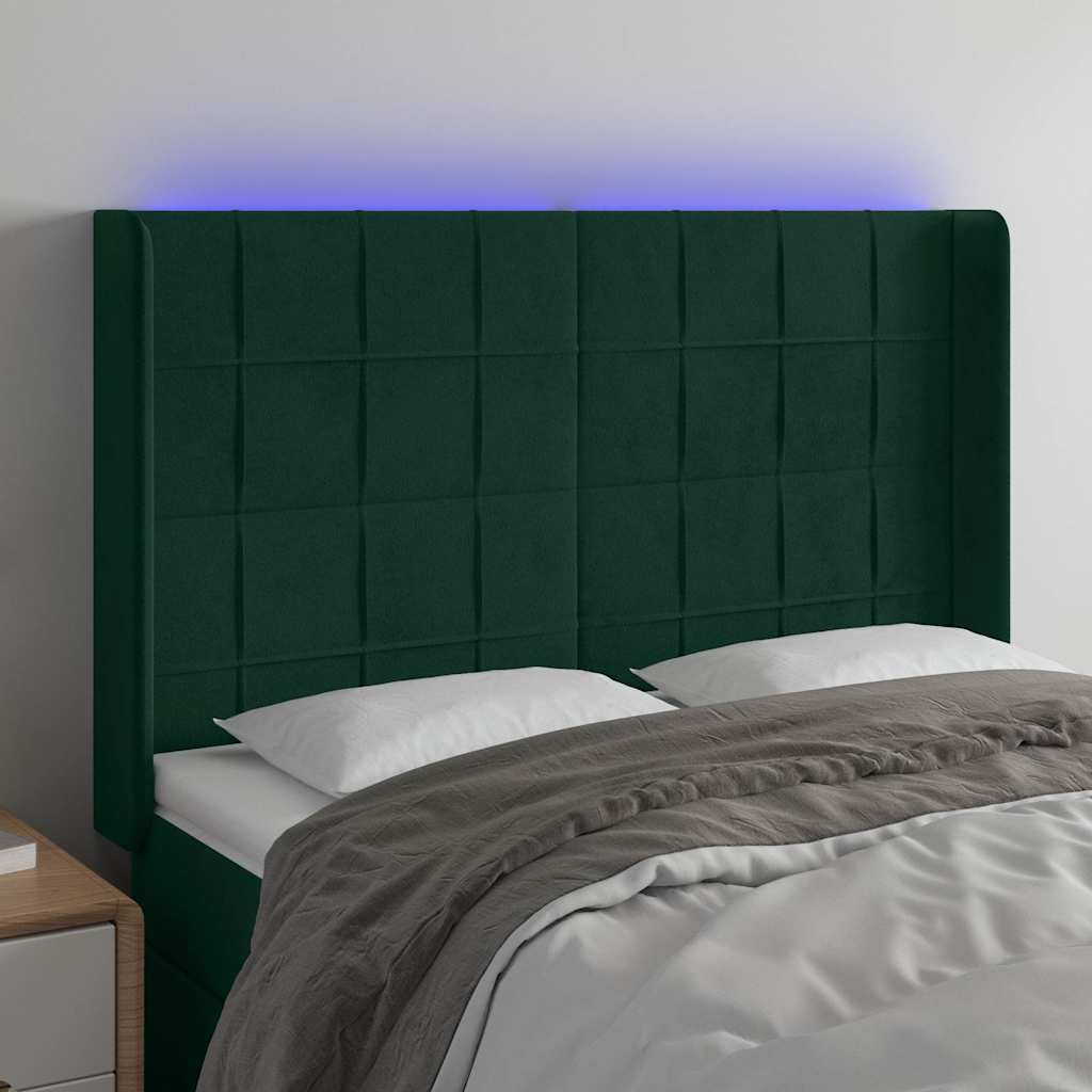 sengegavl med LED-lys 147x16x118/128 cm fløjl mørkegrøn