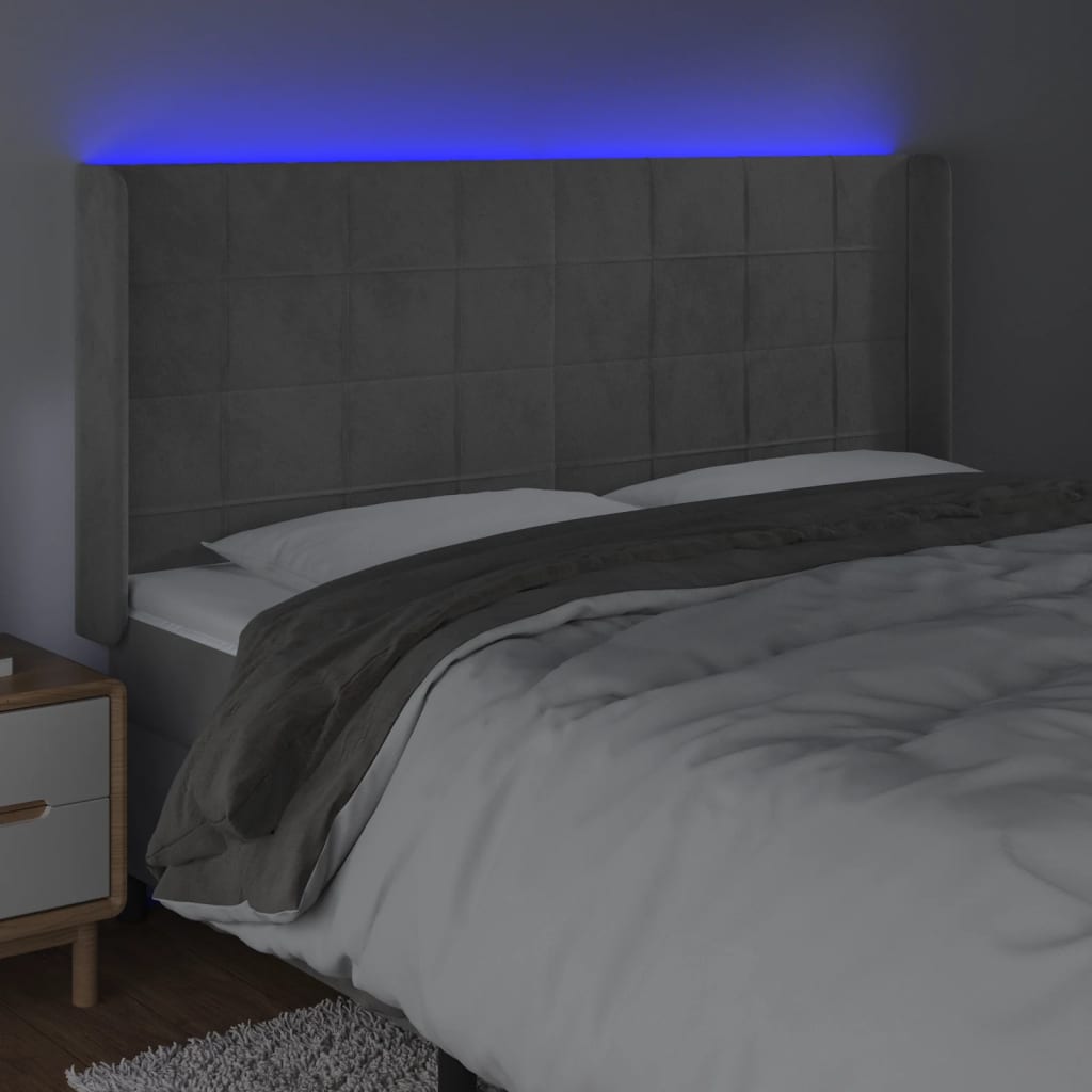 sengegavl med LED-lys 163x16x118/128 cm fløjl lysegrå