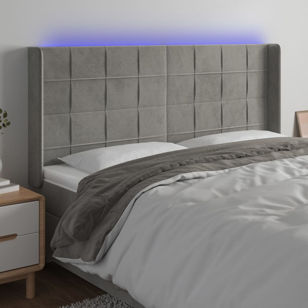 sengegavl med LED-lys 163x16x118/128 cm fløjl lysegrå
