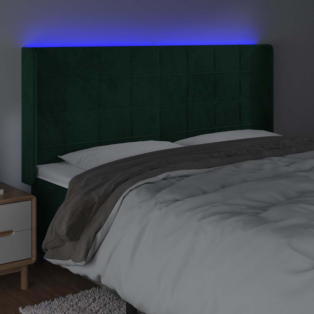 sengegavl med LED-lys 163x16x118/128 cm fløjl mørkegrøn