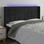 sengegavl med LED-lys 183x16x118/128 cm fløjl sort