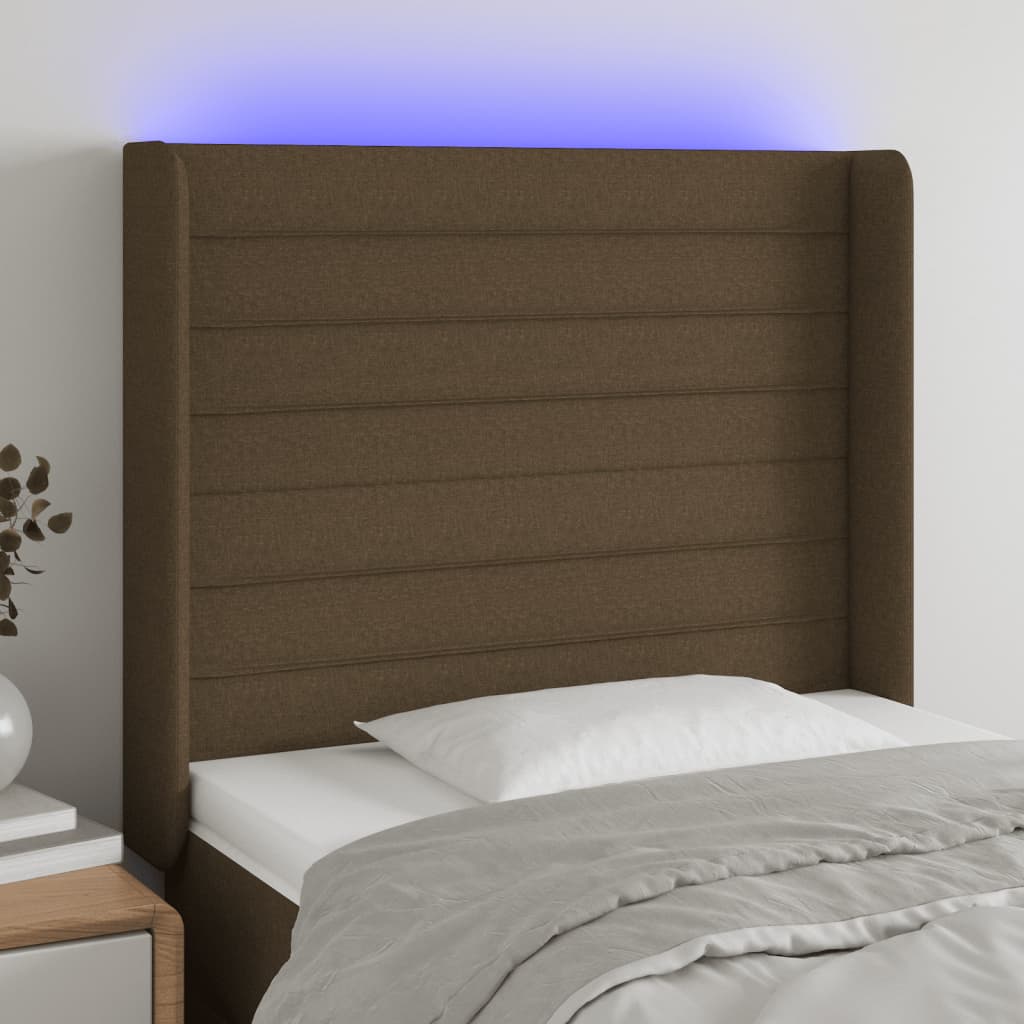sengegavl med LED-lys 83x16x118/128 cm stof mørkebrun