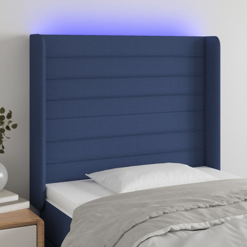 sengegavl med LED-lys 93x16x118/128 cm stof blå