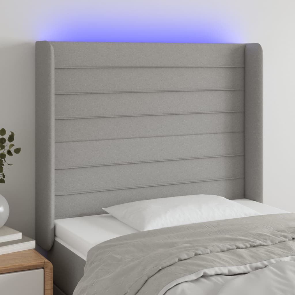 sengegavl med LED-lys 103x16x118/128 cm stof lysegrå