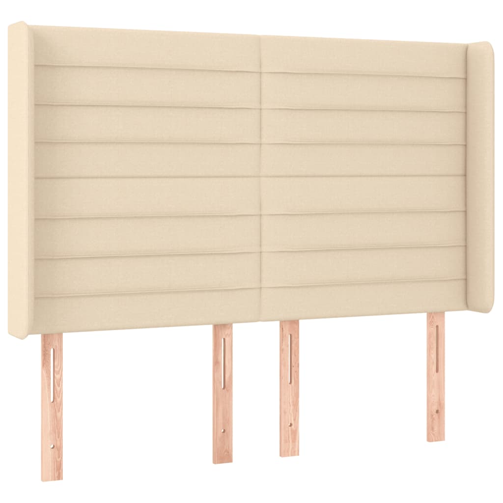 sengegavl med LED-lys 147x16x118/128 cm stof cremefarvet