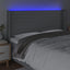 sengegavl med LED-lys 163x16x118/128 cm stof lysegrå