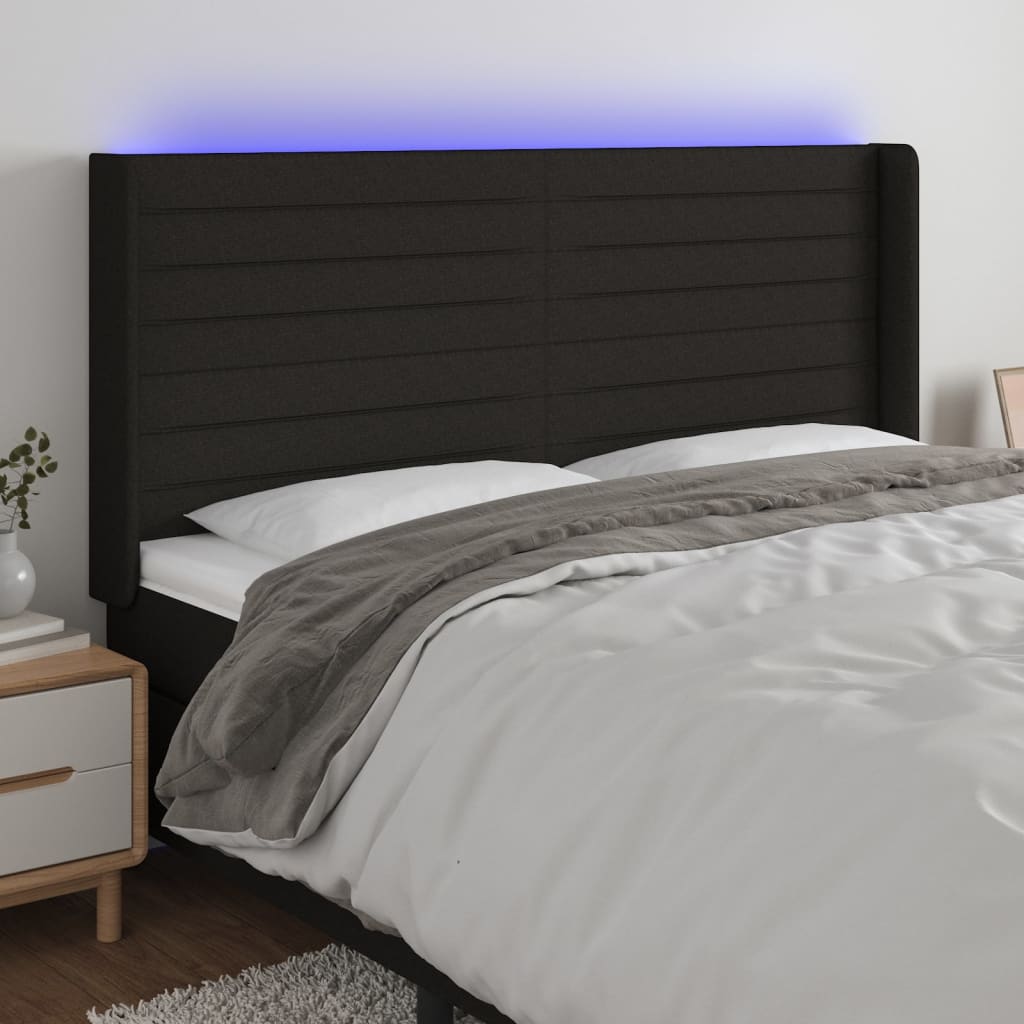 sengegavl med LED-lys 163x16x118/128 cm stof sort