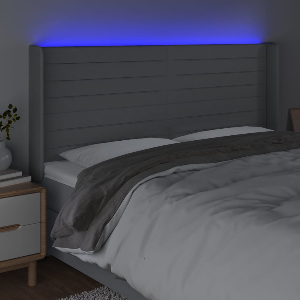 sengegavl med LED-lys 183x16x118/128 cm stof lysegrå