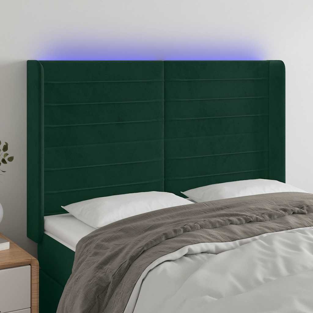 sengegavl med LED-lys 147x16x118/128 cm fløjl mørkegrøn