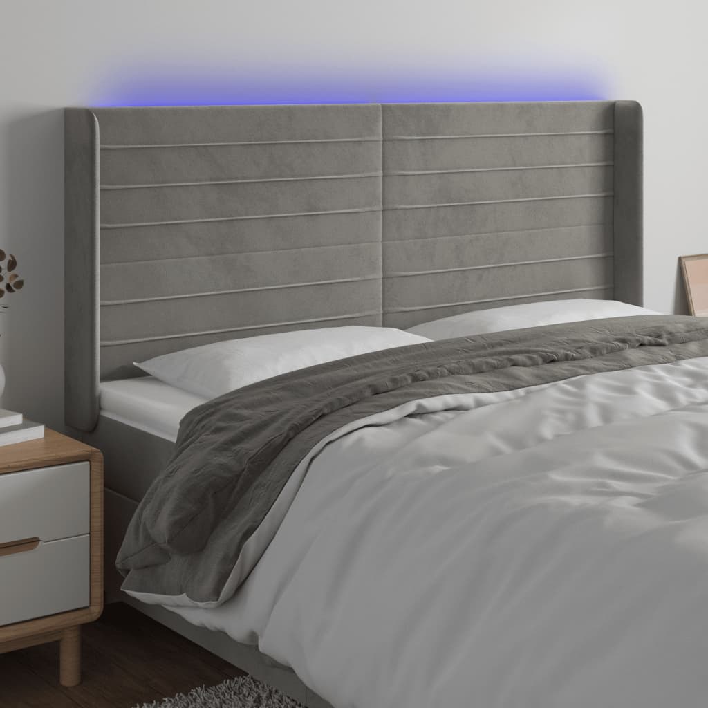 sengegavl med LED-lys 163x16x118/128 cm fløjl lysegrå