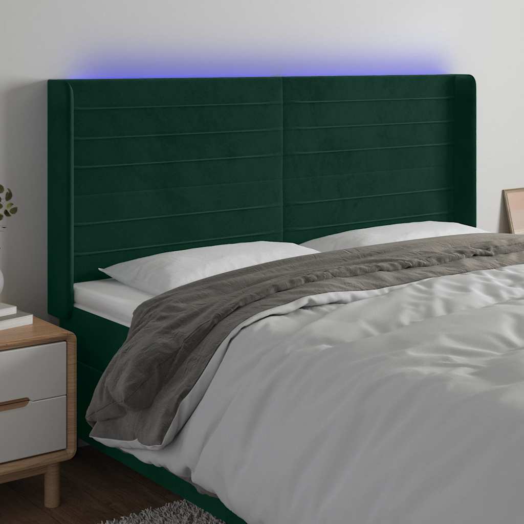 sengegavl med LED-lys 183x16x118/128 cm fløjl mørkegrøn