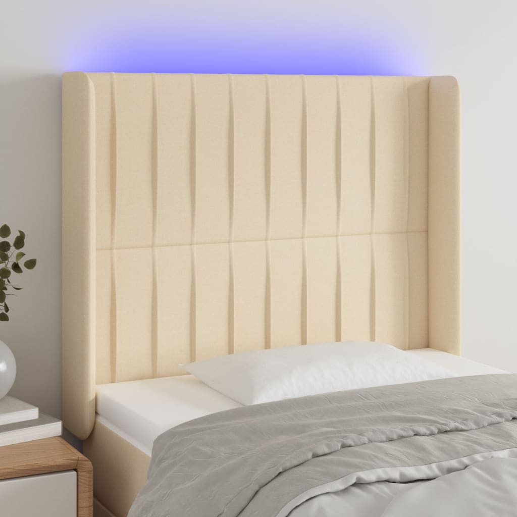 sengegavl med LED-lys 103x16x118/128 cm stof cremefarvet