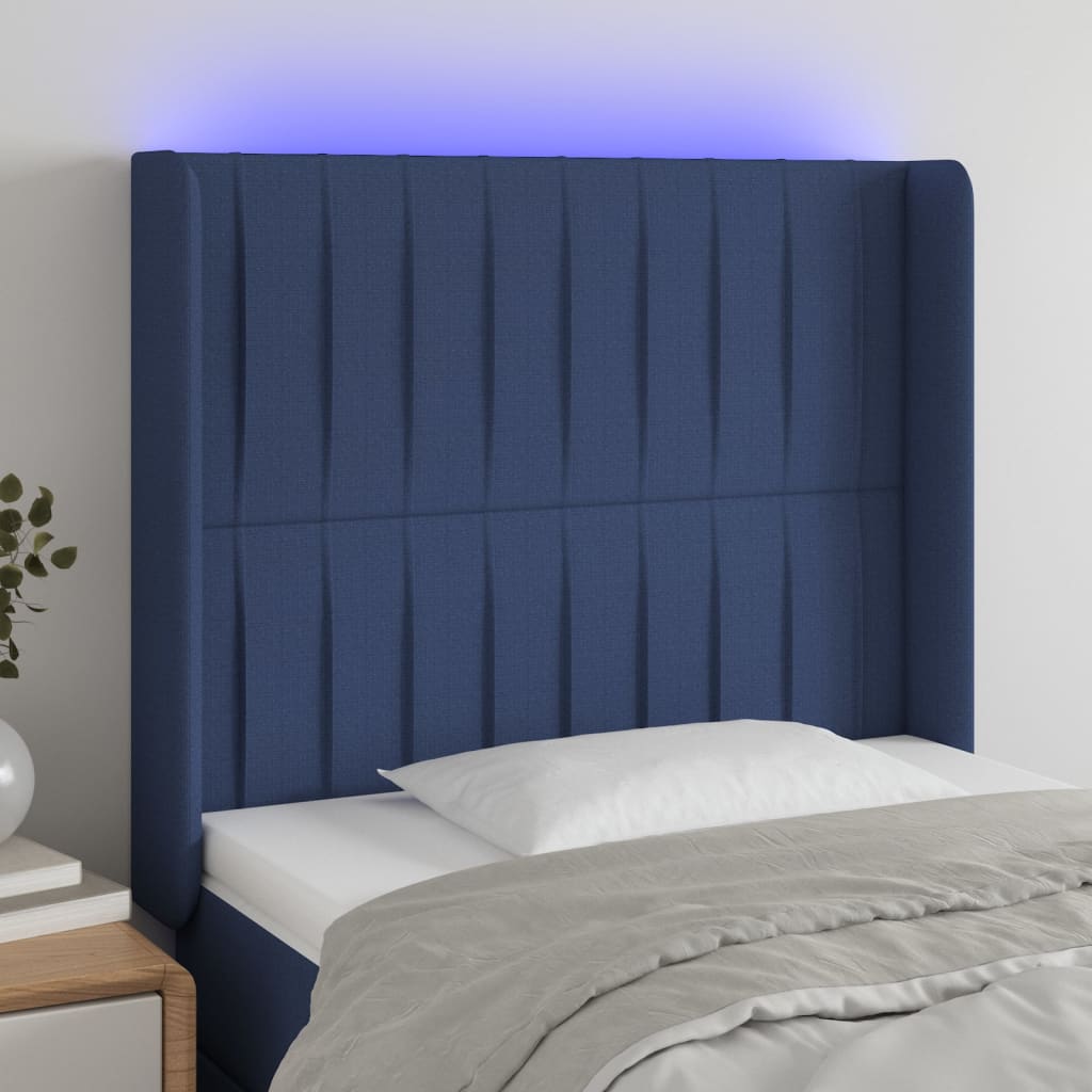 sengegavl med LED-lys 103x16x118/128 cm stof blå