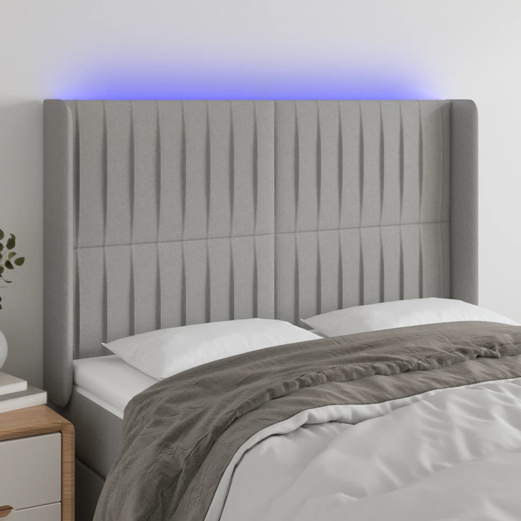sengegavl med LED-lys 147x16x118/128 cm stof lysegrå