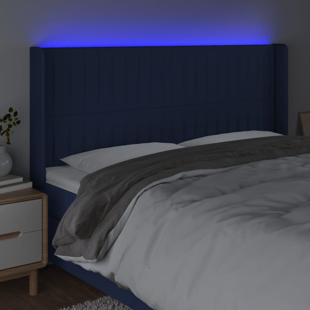 sengegavl med LED-lys 163x16x118/128 cm stof blå