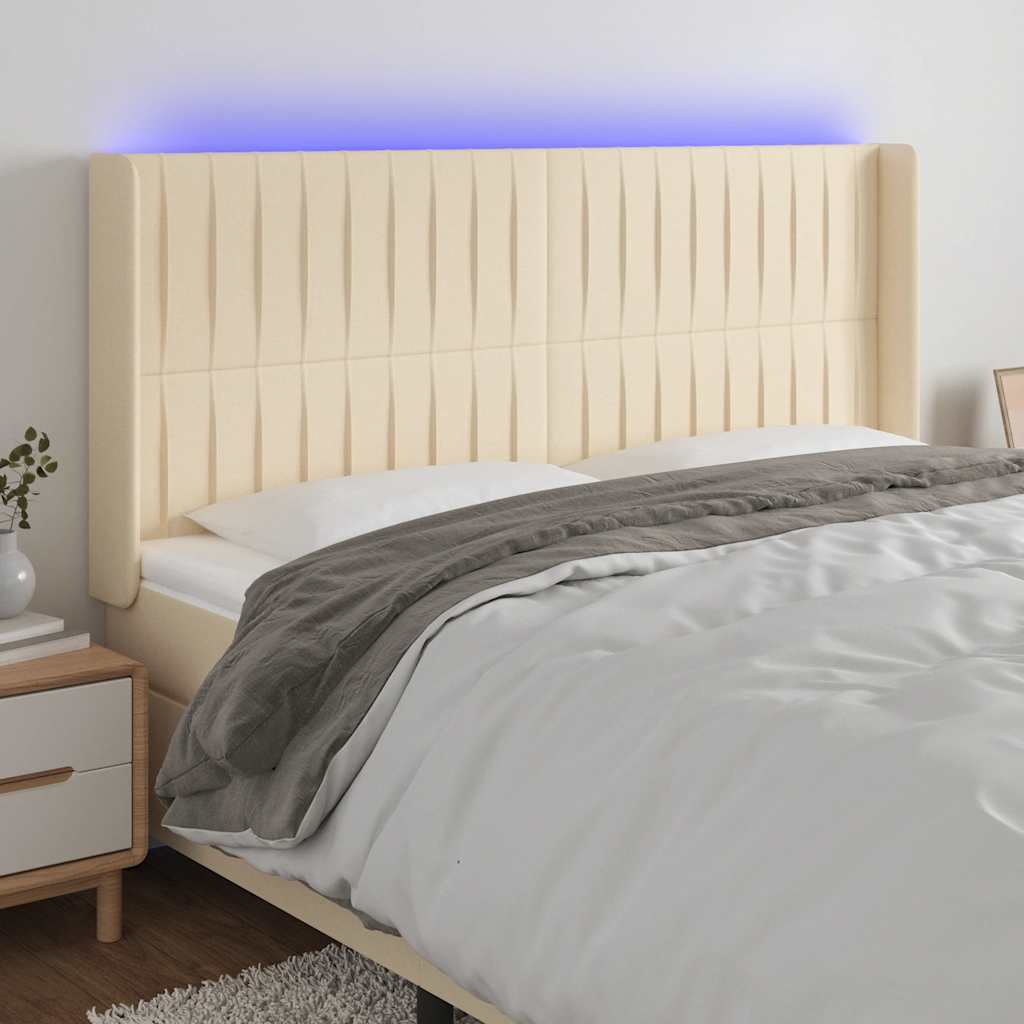 sengegavl med LED-lys 203x16x118/128 cm stof cremefarvet