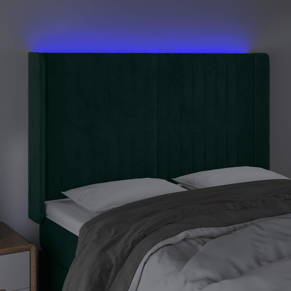 sengegavl med LED-lys 147x16x118/128 cm fløjl mørkegrøn