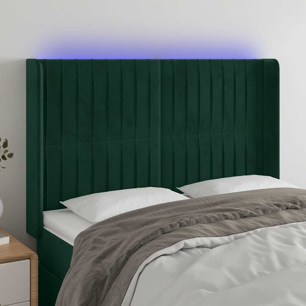 sengegavl med LED-lys 147x16x118/128 cm fløjl mørkegrøn