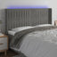 sengegavl med LED-lys 163x16x118/128 cm fløjl lysegrå