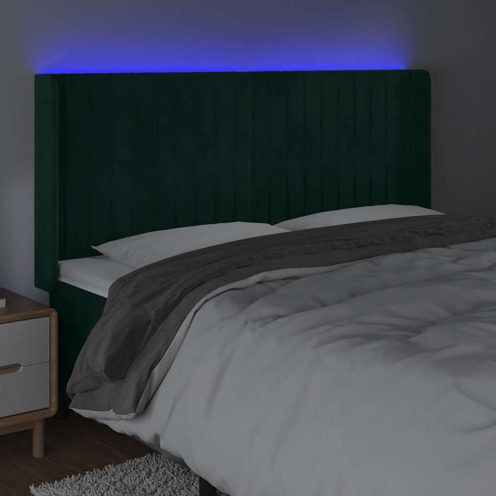 sengegavl med LED-lys 163x16x118/128 cm fløjl mørkegrøn