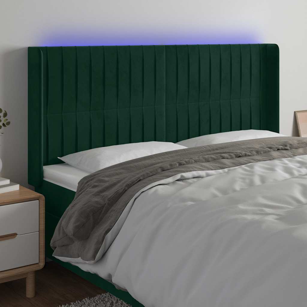 sengegavl med LED-lys 163x16x118/128 cm fløjl mørkegrøn
