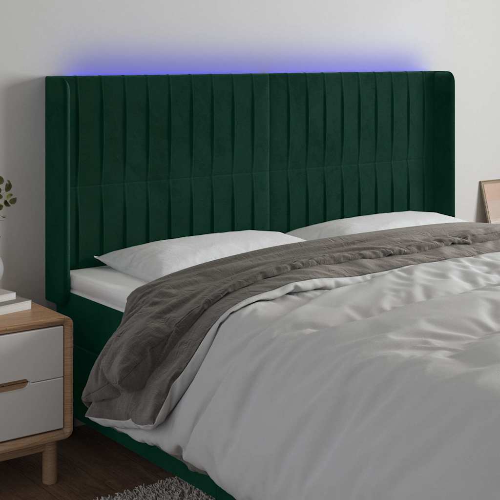 sengegavl med LED-lys 203x16x118/128 cm fløjl mørkegrøn