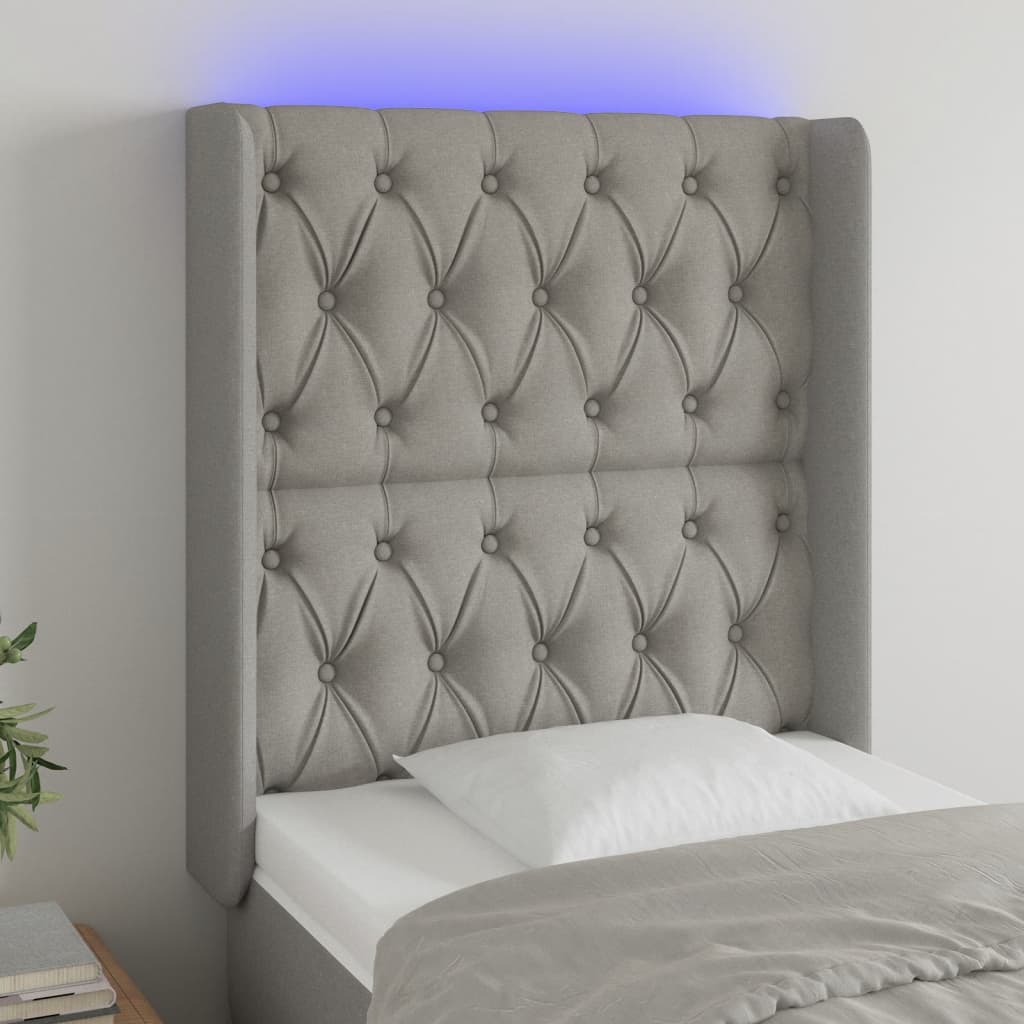 sengegavl med LED-lys 83x16x118/128 cm stof lysegrå