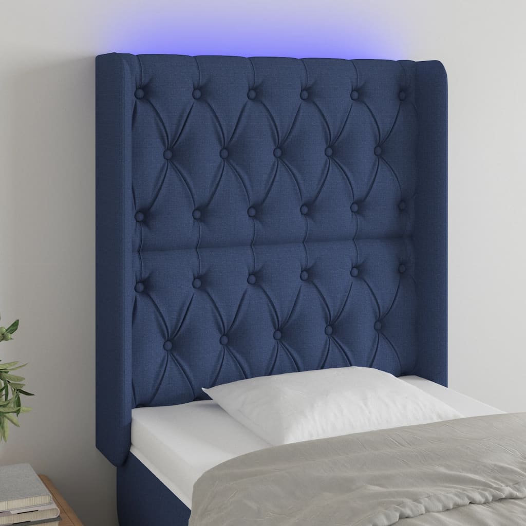 sengegavl med LED-lys 83x16x118/128 cm stof blå