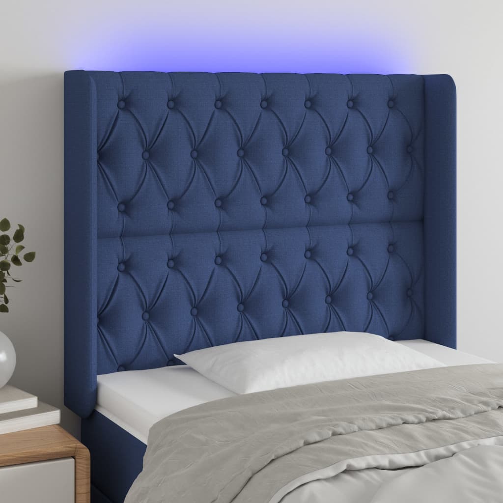 sengegavl med LED-lys 93x16x118/128 cm stof blå