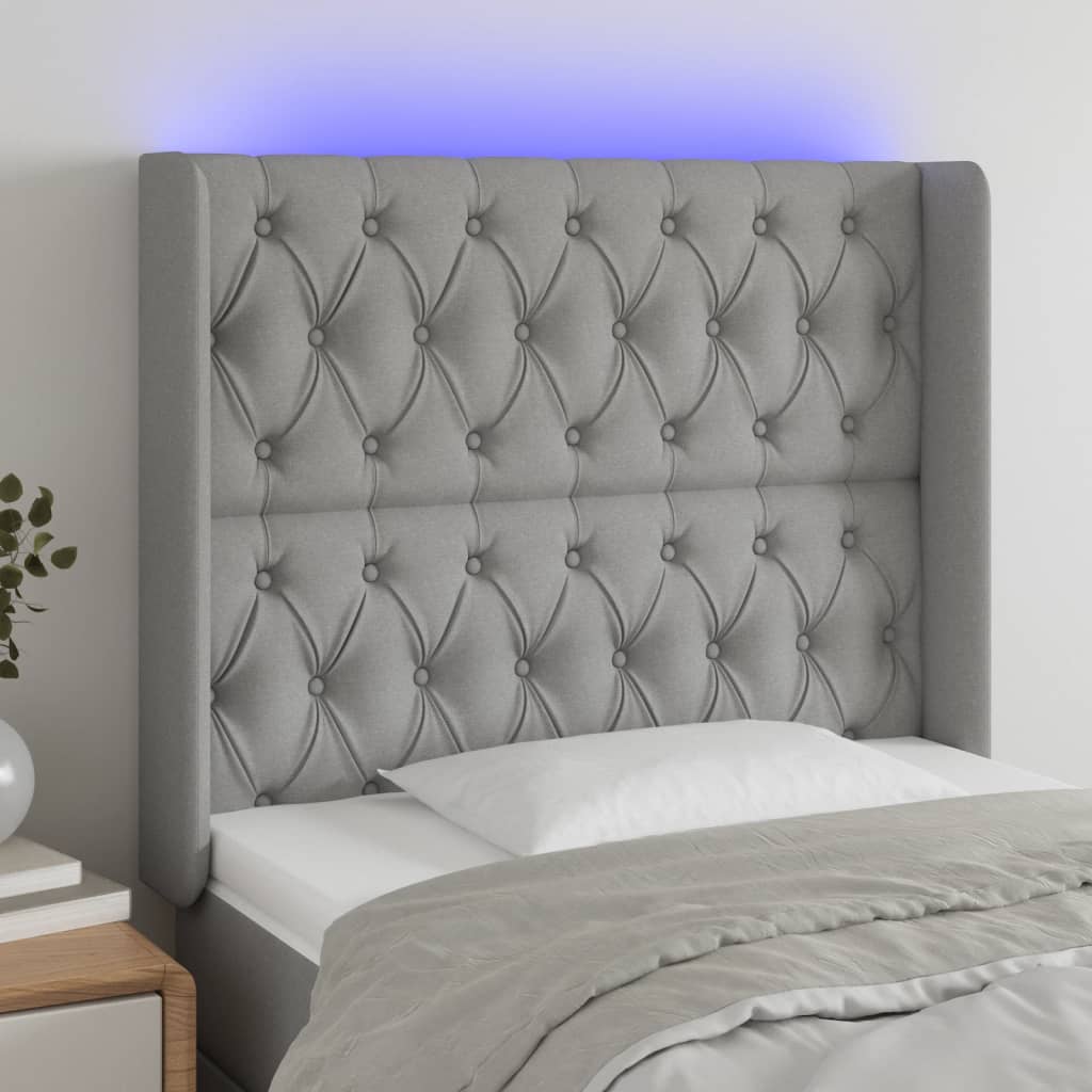 sengegavl med LED-lys 103x16x118/128 cm stof lysegrå
