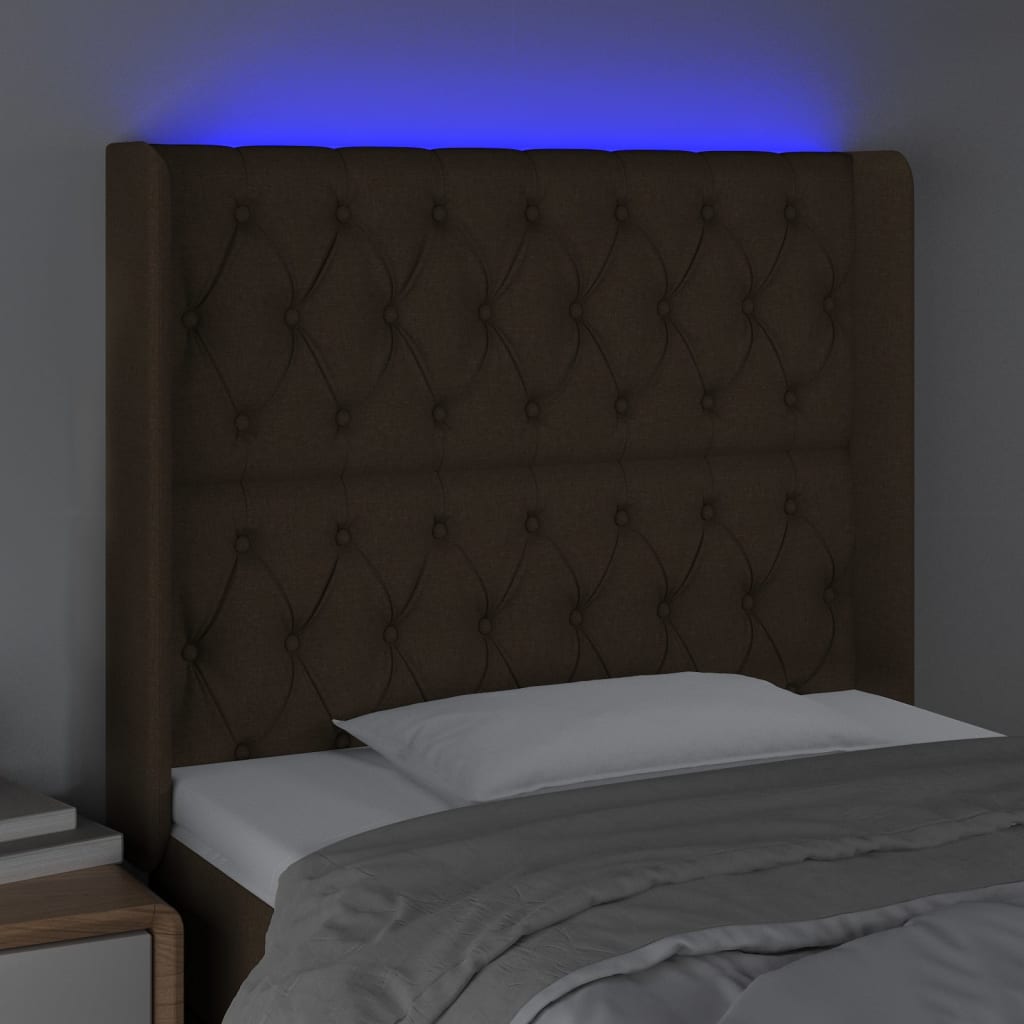sengegavl med LED-lys 103x16x118/128 cm stof mørkebrun