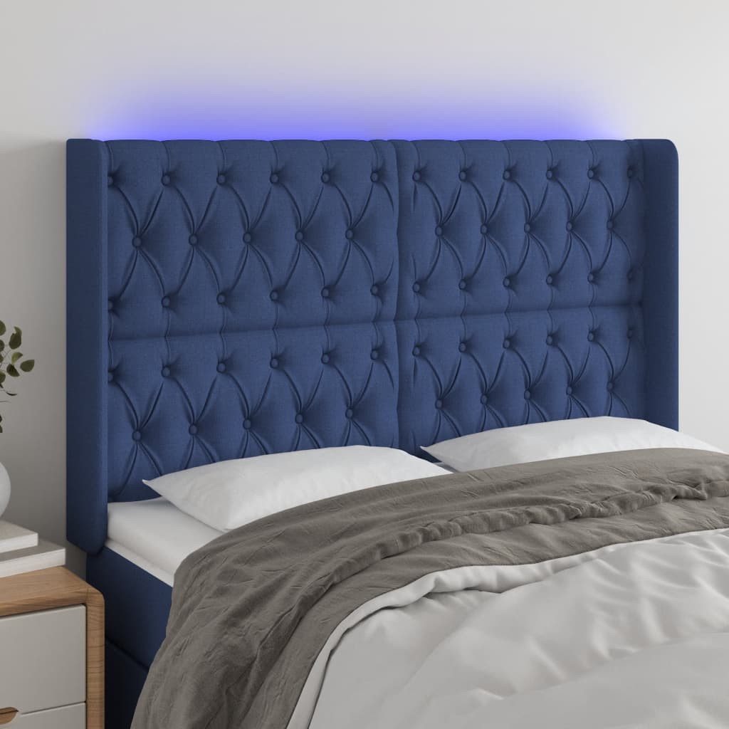 sengegavl med LED-lys 147x16x118/128 cm stof blå