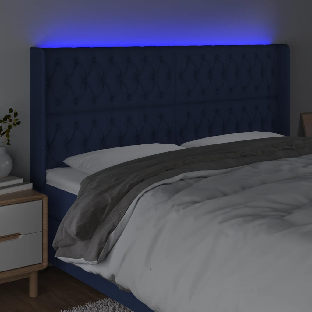 sengegavl med LED-lys 183x16x118/128 cm stof blå