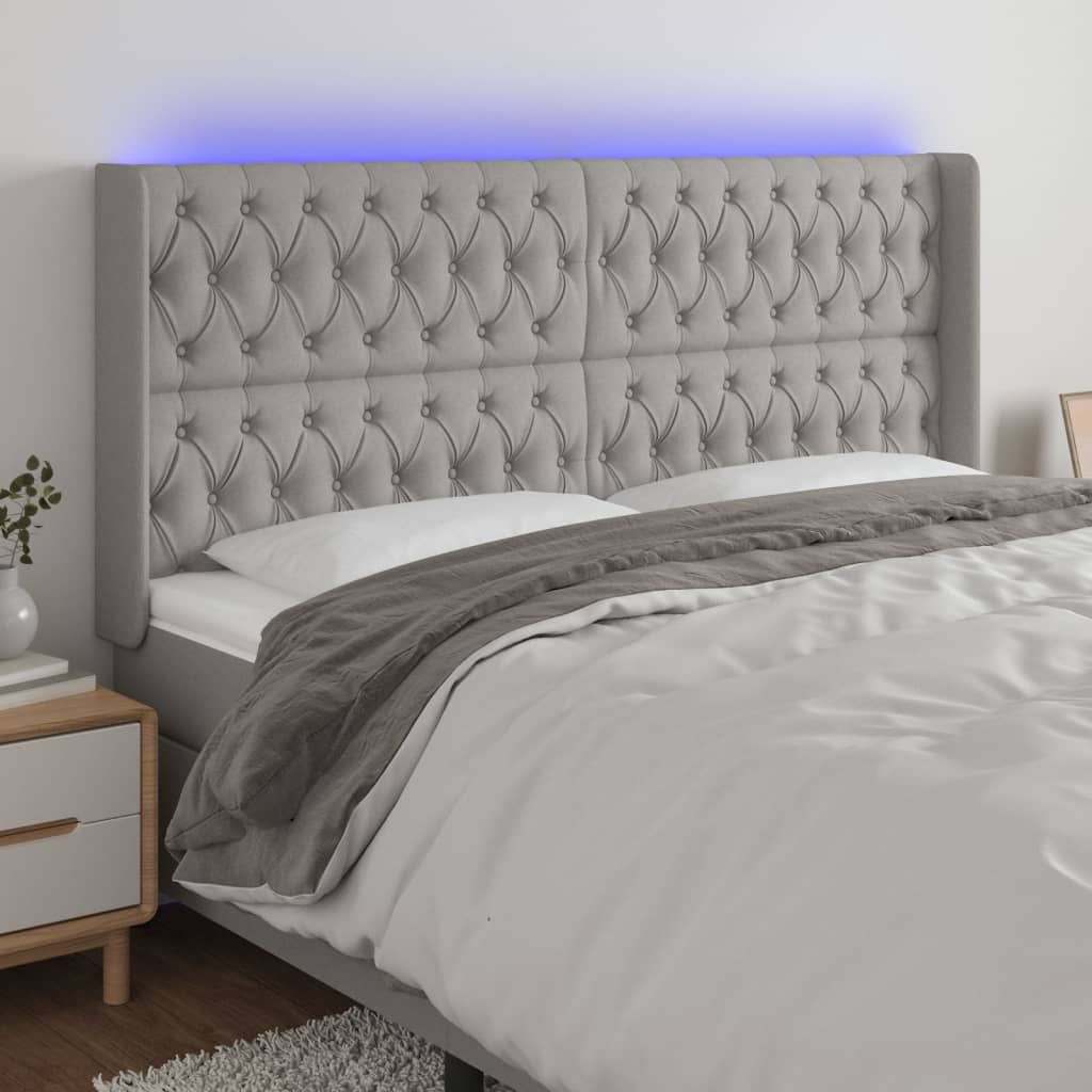 sengegavl med LED-lys 203x16x118/128 cm stof lysegrå
