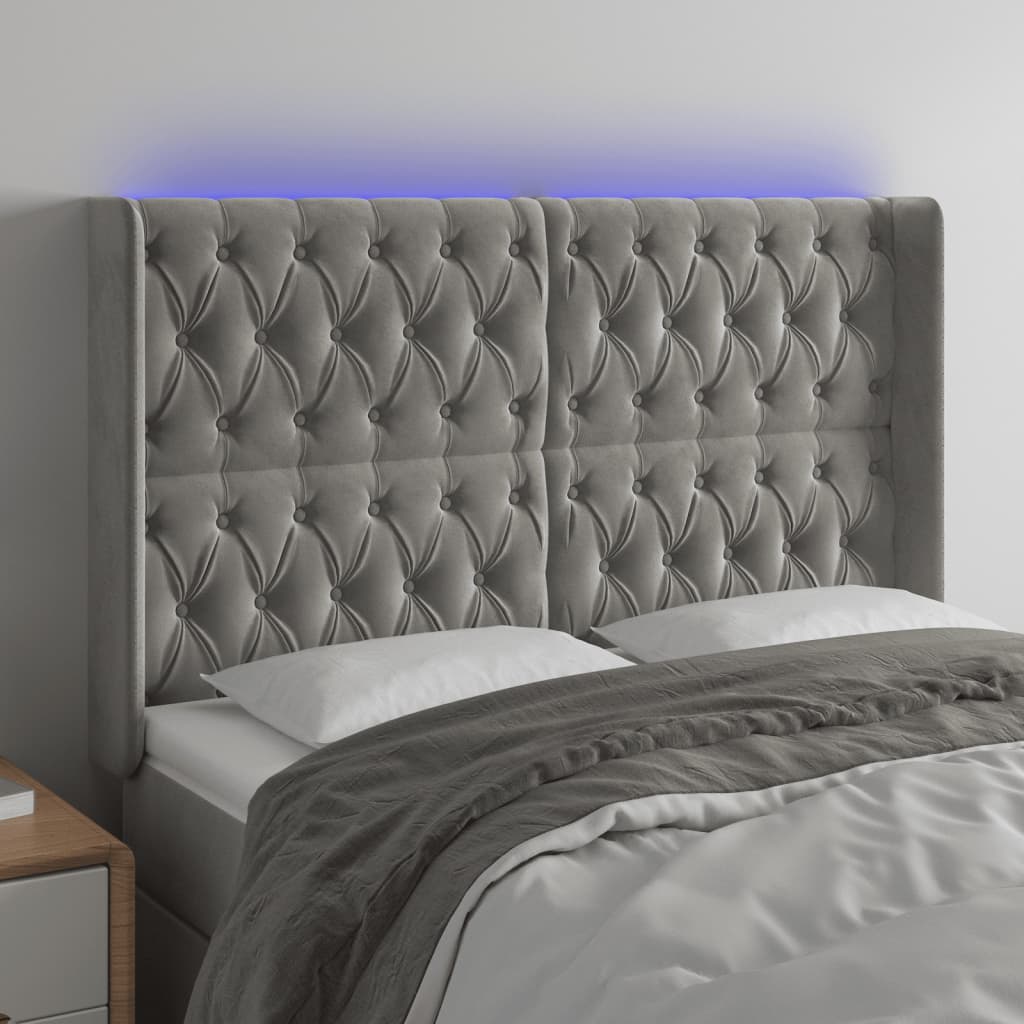 sengegavl med LED-lys 147x16x118/128 cm fløjl lysegrå