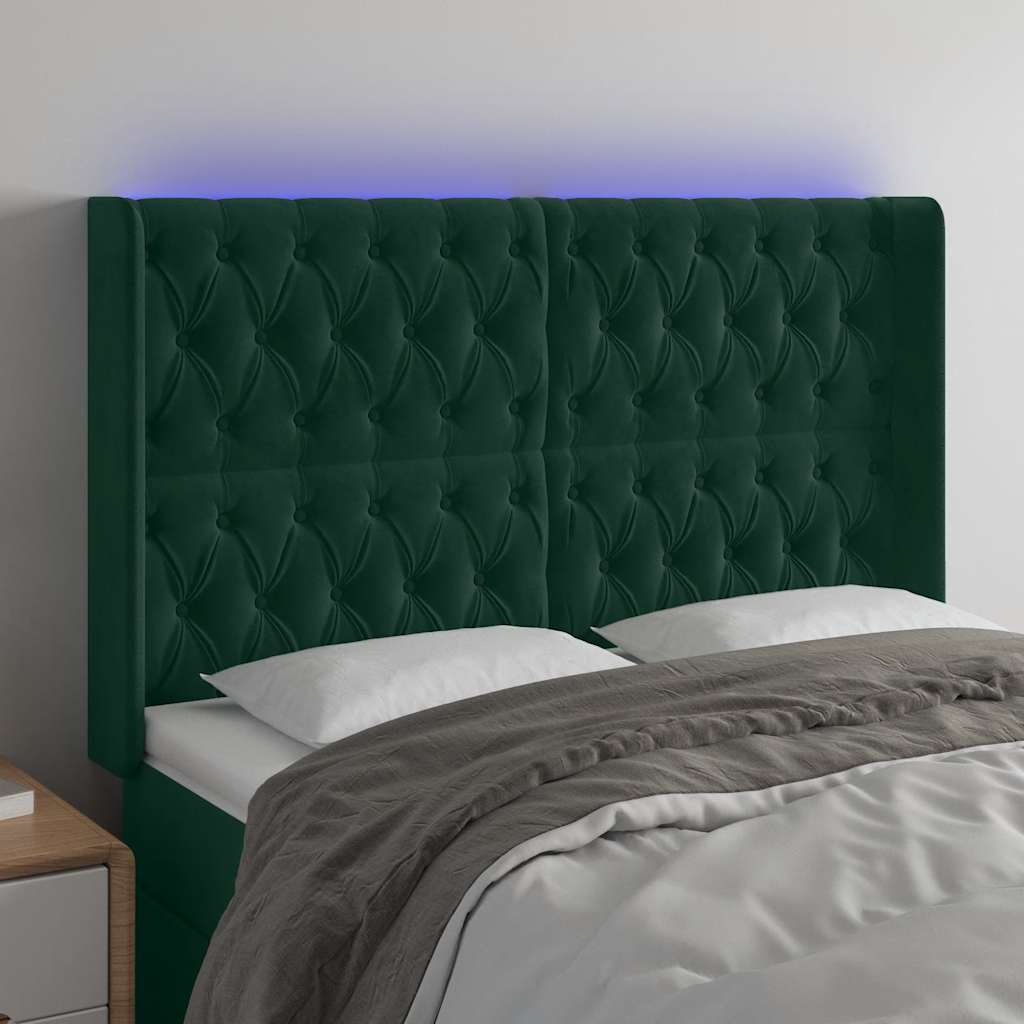 sengegavl med LED-lys 163x16x118/128 cm fløjl mørkegrøn