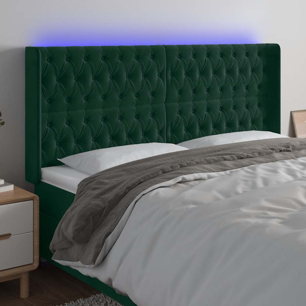 sengegavl med LED-lys 183x16x118/128 cm fløjl mørkegrøn