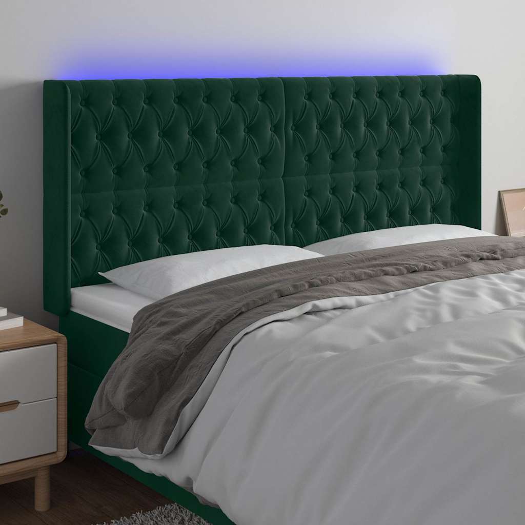 sengegavl med LED-lys 203x16x118/128 cm fløjl mørkegrøn