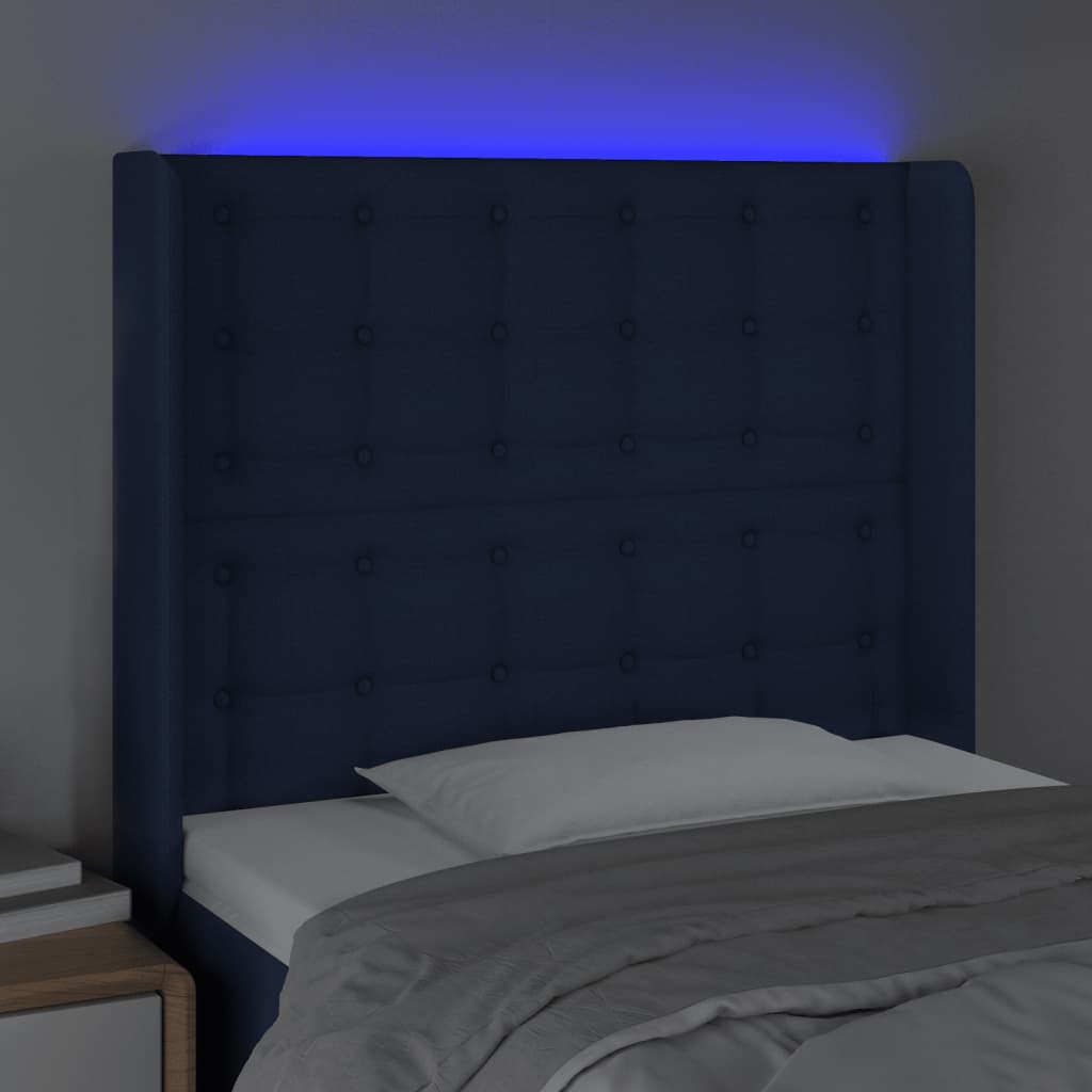 sengegavl med LED-lys 83x16x118/128 cm stof blå
