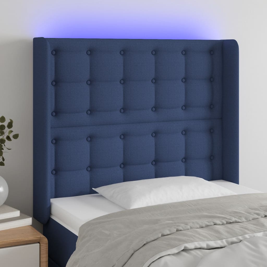 sengegavl med LED-lys 93x16x118/128 cm stof blå