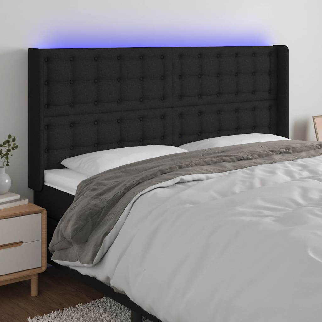 sengegavl med LED-lys 163x16x118/128 cm stof sort