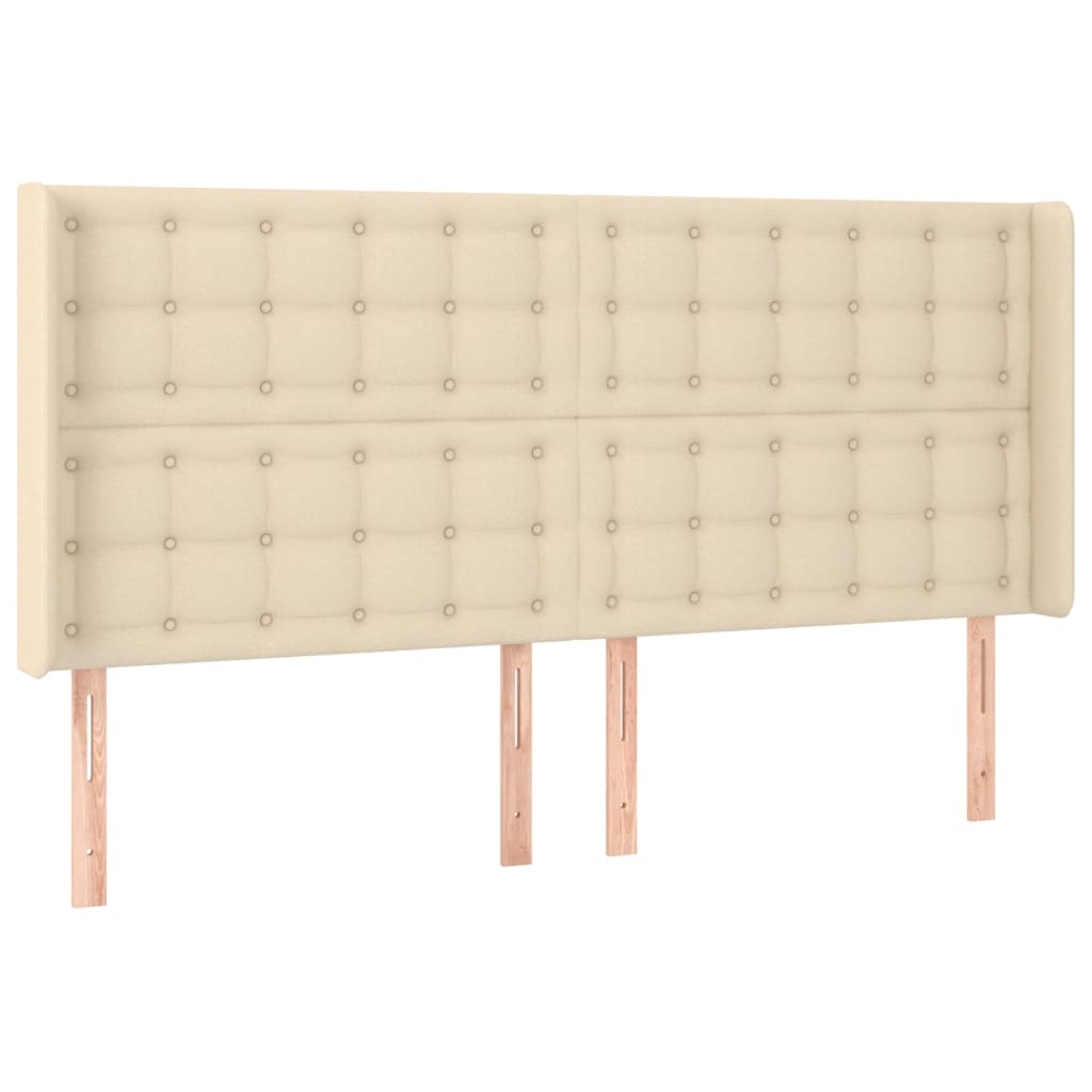 sengegavl med LED-lys 163x16x118/128 cm stof cremefarvet