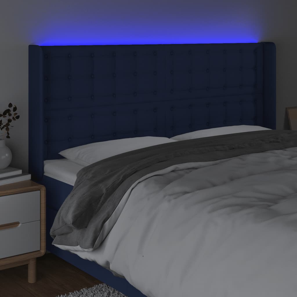 sengegavl med LED-lys 163x16x118/128 cm stof blå