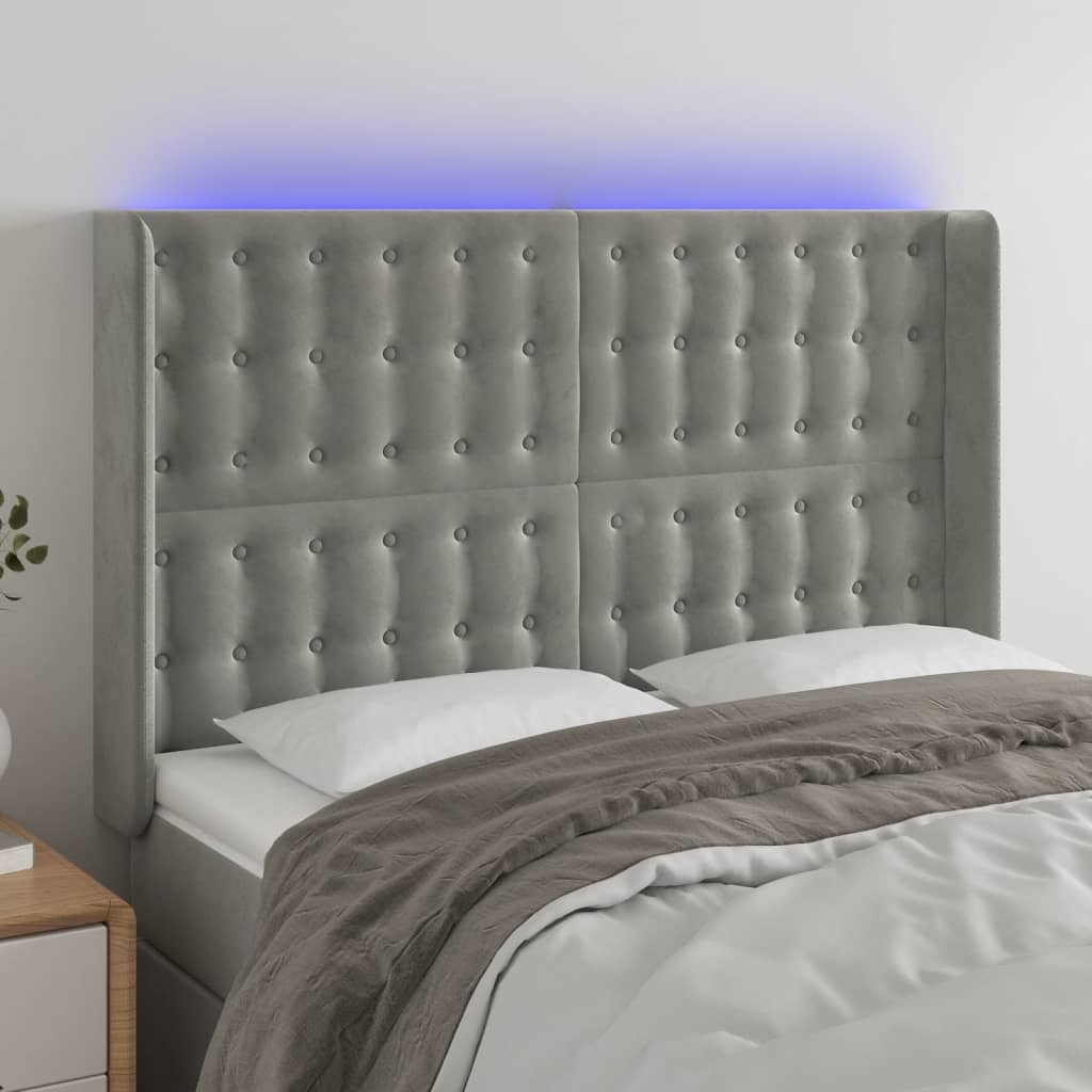 sengegavl med LED-lys 147x16x118/128 cm fløjl lysegrå