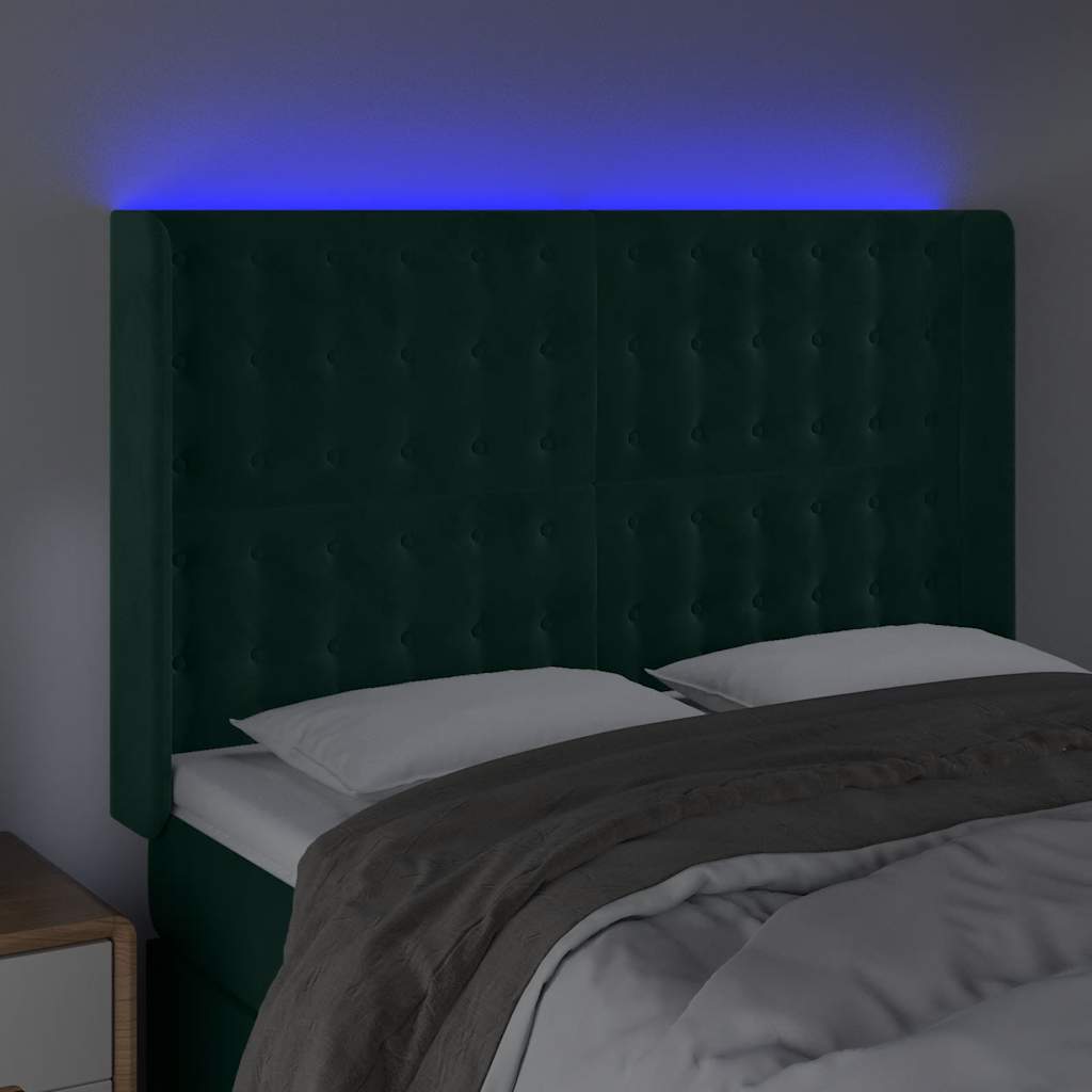 sengegavl med LED-lys 147x16x118/128 cm fløjl mørkegrøn