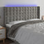 sengegavl med LED-lys 163x16x118/128 cm fløjl lysegrå