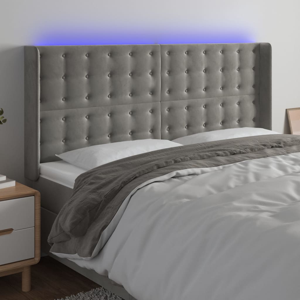 sengegavl med LED-lys 163x16x118/128 cm fløjl lysegrå