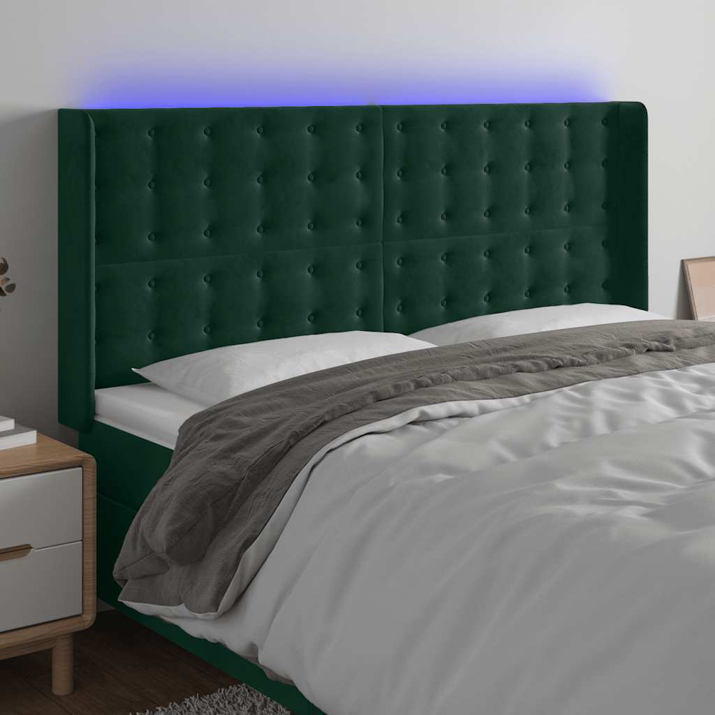 sengegavl med LED-lys 163x16x118/128 cm fløjl mørkegrøn